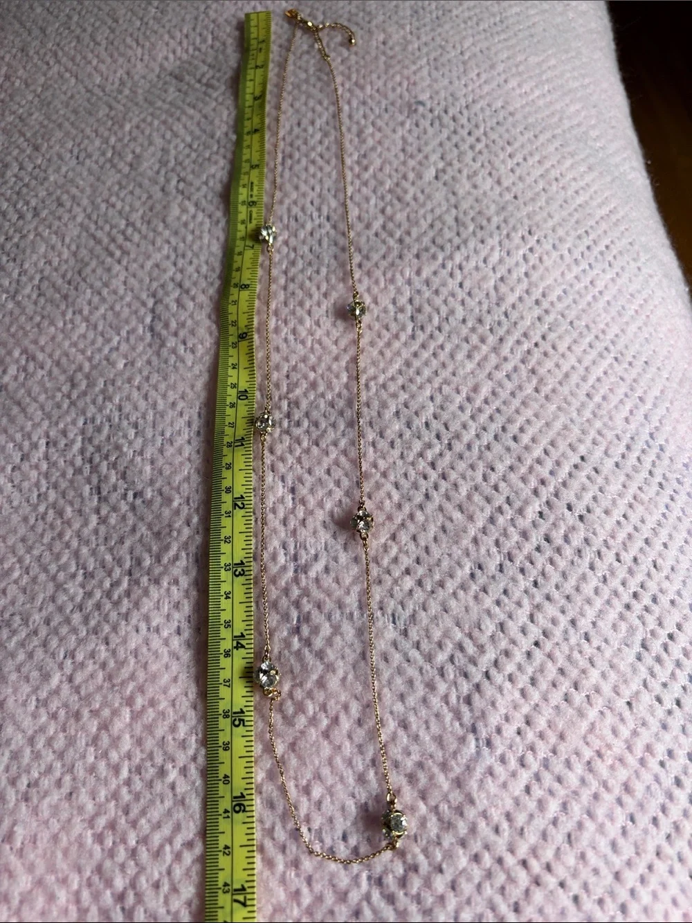 Kate Spade long golden necklace with crystal beads.